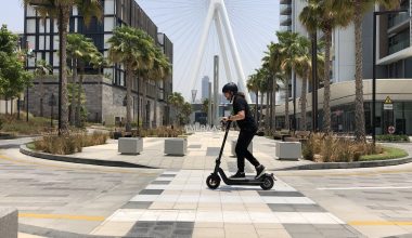 An electric scooter commuter riding a NIU KQi3