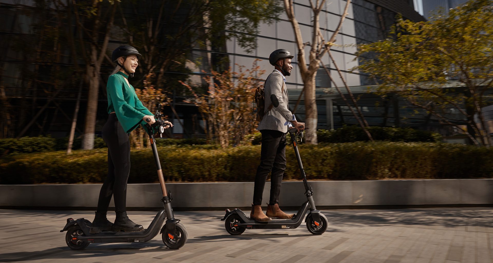 Two riders enjoying an urban adventure on NIU kick scooters