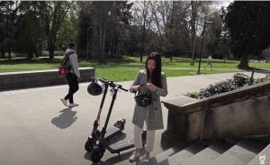 Miki Rai testing out the KQi3 electric kick scooter