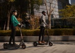 Two riders enjoying an urban adventure on NIU kick scooters